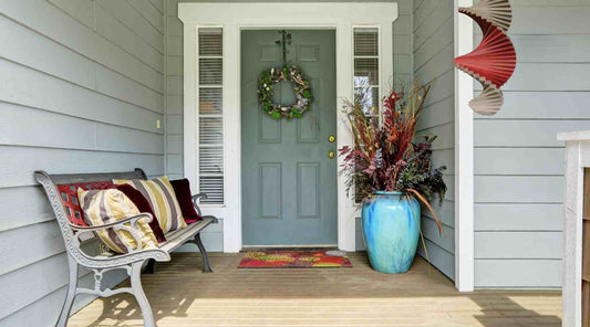 Wood Wind Spinner at house's entrance and porch.